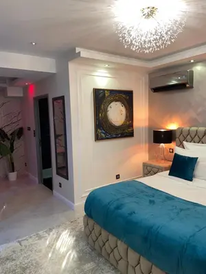 Un ou plusieurs lits dans un hébergement de l'établissement NUITS D'HERMES & Spa