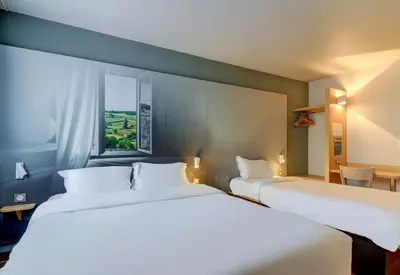 Un ou plusieurs lits dans un hébergement de l'établissement B&B HOTEL Le Creusot Montchanin