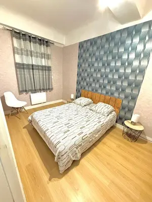 Un ou plusieurs lits dans un hébergement de l'établissement Le Rétro - Appartement 2 chambres confortable et calme - Proche du centre ville de Mâcon - Stationnement facile à proximité