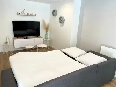 Un ou plusieurs lits dans un hébergement de l'établissement Appartement 2 chambres en plein centre ville