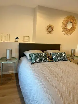 Un ou plusieurs lits dans un hébergement de l'établissement Appartement 2 chambres en plein centre ville