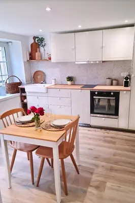 Cuisine ou kitchenette dans l'établissement Le petit cocon de Chateau Chalon
