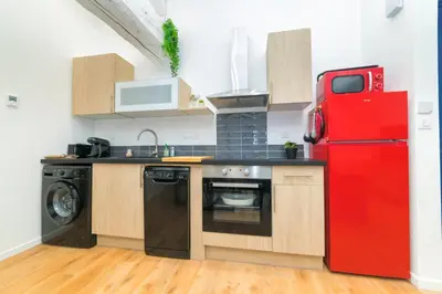 Cuisine ou kitchenette dans l'établissement Tintin - Locationtournus