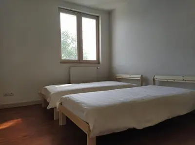 Un ou plusieurs lits dans un hébergement de l'établissement Maison 3 chambres 6 lits Netflix Parking