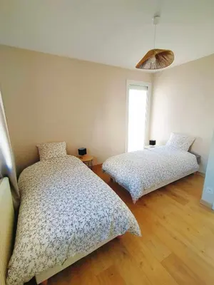 Un ou plusieurs lits dans un hébergement de l'établissement L'étape Nuitonne - Gîte avec jardin pour 6 personnes