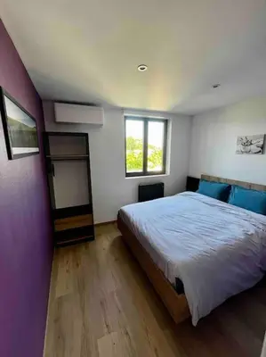 Un ou plusieurs lits dans un hébergement de l'établissement Loft vu sur Pommard