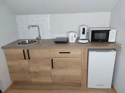 Cuisine ou kitchenette dans l'établissement Famille House 202
