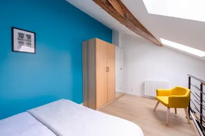 Un ou plusieurs lits dans un hébergement de l'établissement Duplex Standing - Hyper Centre - Tout équipé
