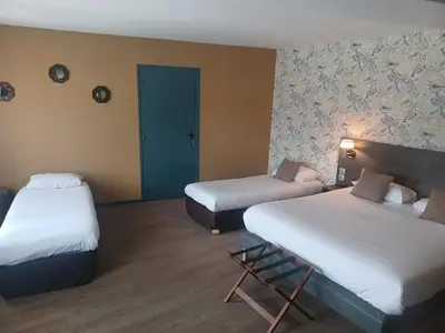 Un ou plusieurs lits dans un hébergement de l'établissement Hôtel La Parenthèse