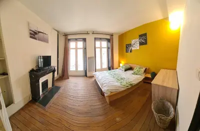 Un ou plusieurs lits dans un hébergement de l'établissement Le Thiers Appartement