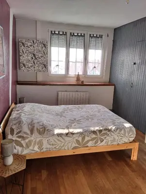 Un ou plusieurs lits dans un hébergement de l'établissement Bel appartement a la campagne avec magnifique vue