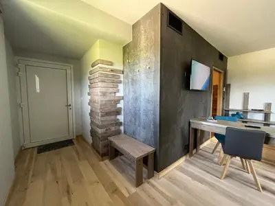 Télévision ou salle de divertissement dans l'établissement Hôtel En Tilleul