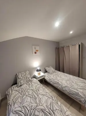 Un ou plusieurs lits dans un hébergement de l'établissement Appartement Le Duplex
