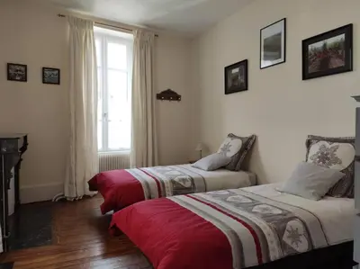 Un ou plusieurs lits dans un hébergement de l'établissement Gîte de charme en Hautes Côtes de Beaune