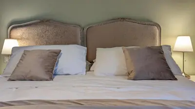 Un ou plusieurs lits dans un hébergement de l'établissement Chambres d'Hotes CASCAROT