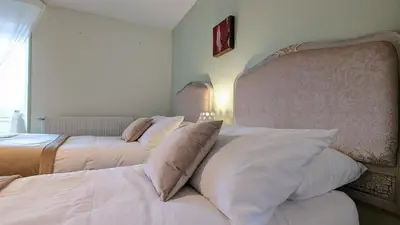 Un ou plusieurs lits dans un hébergement de l'établissement Chambres d'Hotes CASCAROT