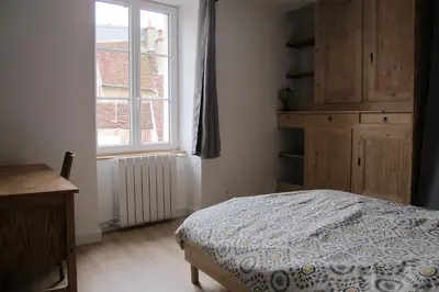 Un ou plusieurs lits dans un hébergement de l'établissement POLIGNY, appartement centre ville