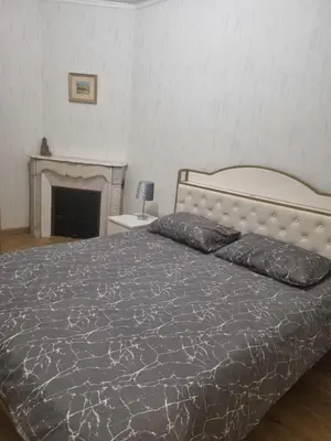 Un ou plusieurs lits dans un hébergement de l'établissement Appartement au cœur de la ville