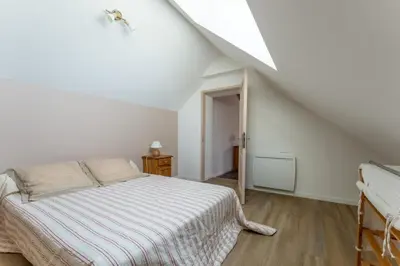 Un ou plusieurs lits dans un hébergement de l'établissement Gite Chateau 3 chambres piscine chauffée